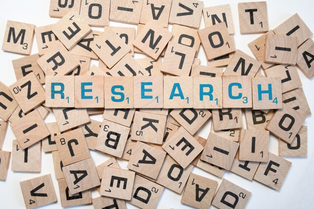 picture of cubes with letters inside spelling out research 